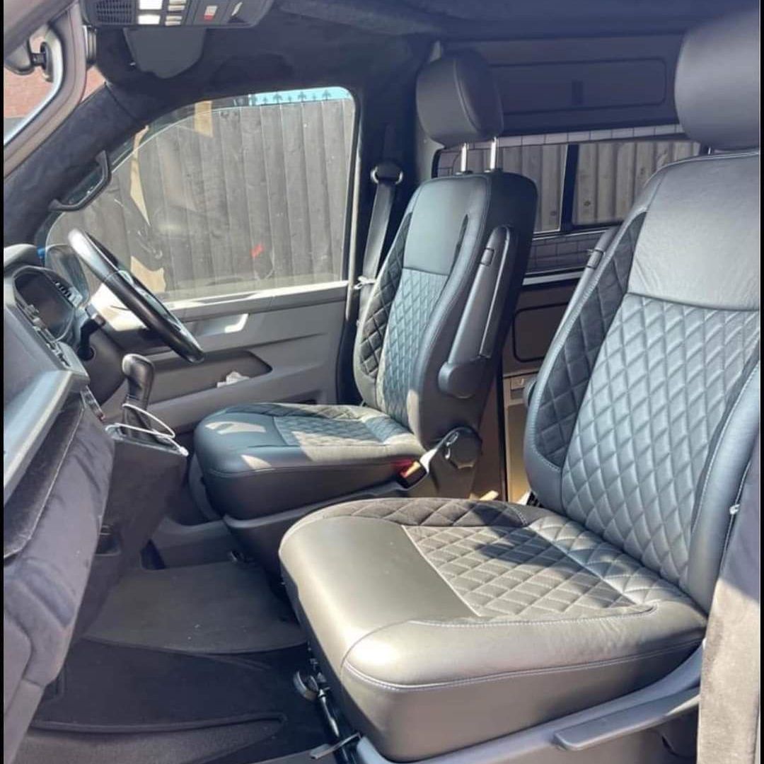 Front interior view of a camper van conversion completed by Indigo Blue Campers