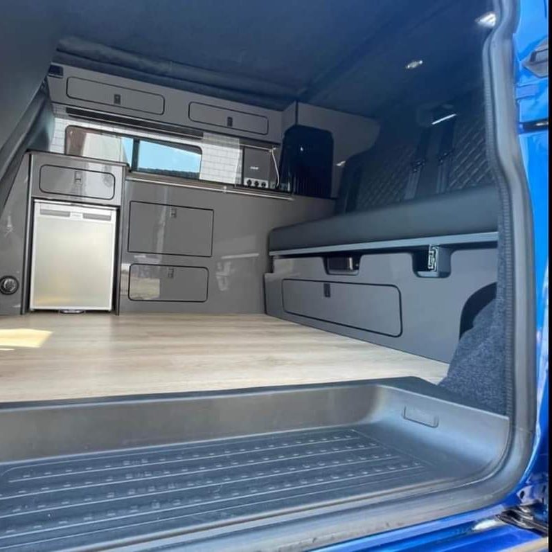 Side interior view of a campervan conversion by Indigo Blue Campers