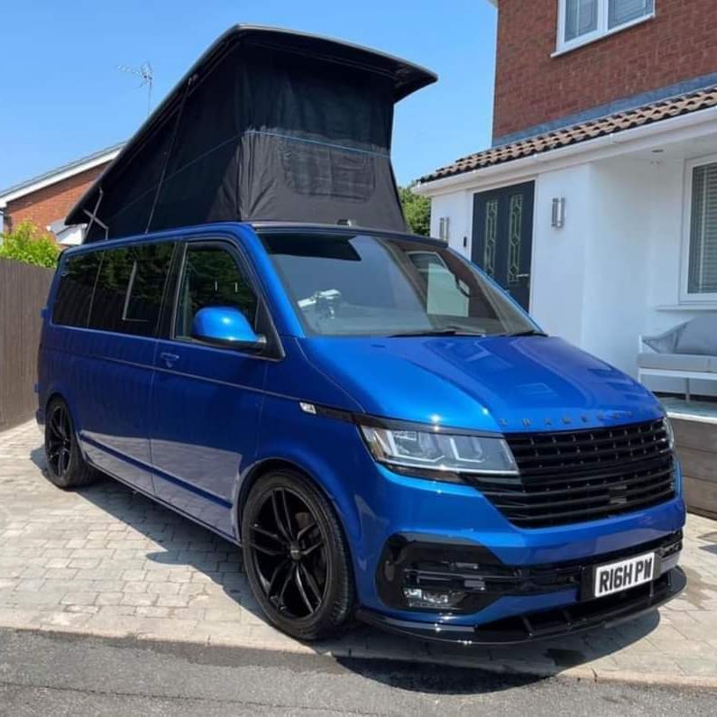 Front exterior view of a completed camper van conversion by Indigo Blue Campers